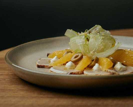 torched kingfish cured in green olive brine, horseradish & cara cara orange