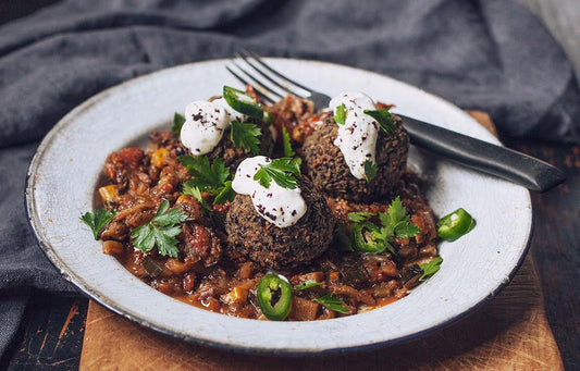 beluga black lentil balls with veggie ragu