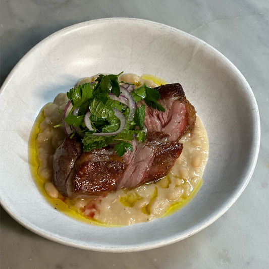 roasted lamb rump with white beans & bergamot pressed olive oil