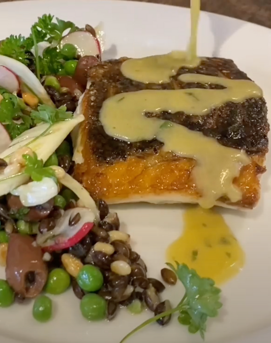 grilled barramundi with black barley, fennel & green pea salad