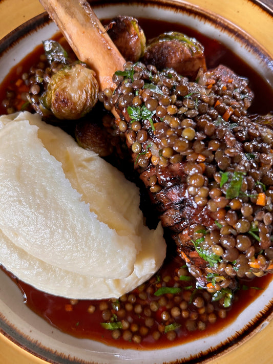 braised lamb shanks with green lentils, roasted brussels sprouts & olive oil mash potatoes